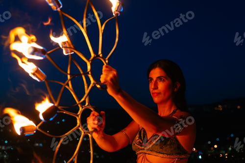 Preview: Woman with fire fans at night