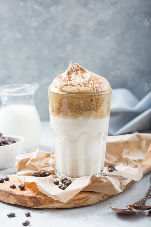 Preview: Dalgona creamy coffee in a glass on a light gray background with whipped foam. Korean food trend