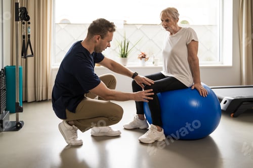 Preview: Physical Therapist Assisting Senior Woman with Exercise