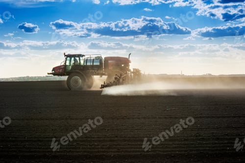 Preview: self-propelled sprayer in work at field in early spring
