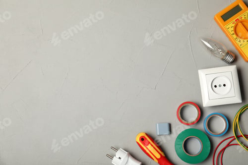 Preview: Flat lay composition with electrician's tools and space for text on gray background