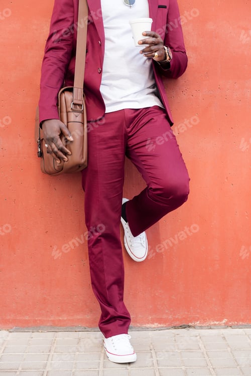 Preview: unrecognizable stylish man with bag and coffee