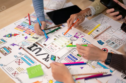 Preview: Close up view of young professional UX UI designer discussion on their project in the meeting room.