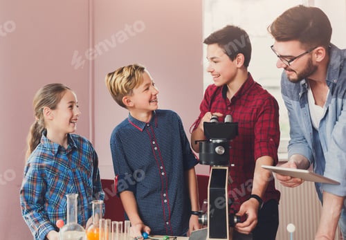 Preview: Stem Education. Teenagers With Teacher Making Chemical Experiment In Laboratory With Reagents And