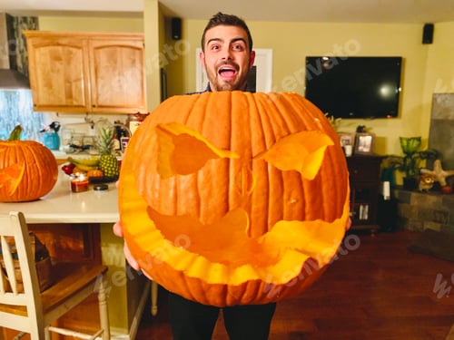Preview: Showing off a freshly carved pumpkin on Halloween