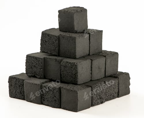 Preview: Cube-shaped coal briquettes stacked on each other isolated on a white background
