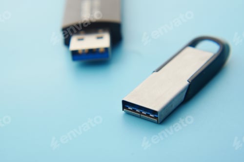 Preview: USB flash drive on blue background close up