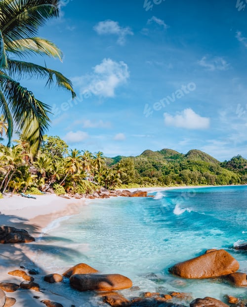 Preview: Mahe, Seychelles. Beautiful Anse intendance beach. Calm ocean waves rolling towards the shore with