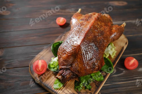 Preview: roast duck and vegetables on a dark wooden board