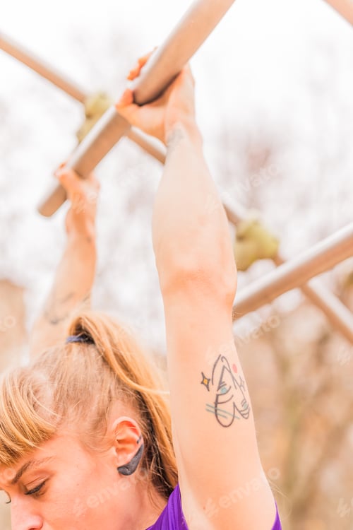 Preview: Calisthenics pull- up back exercise for cross fitness workout. Hispanic mid sportswoman athletic