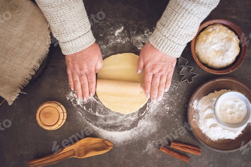 Preview: Process of making christmas cookies. Mature woman, granny hands making dough. Ingredients for baking