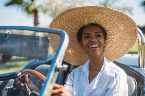 Preview: Black woman driving a vintage convertible car
