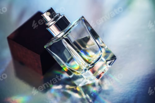Preview: Close-Up of Glass Perfume Bottle with Rainbow Reflections