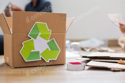 Preview: Cardboard Box With Recycling Symbol On Wooden Floor