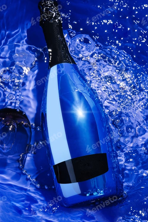 Preview: blue champagne bottle and glass in water