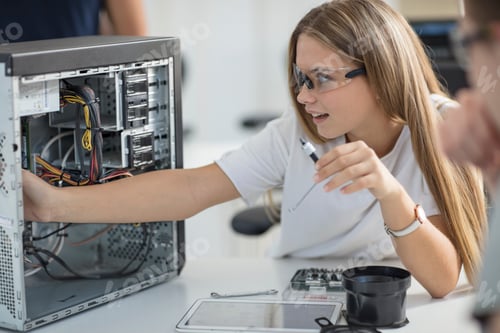 Preview: Students assembling computer in class