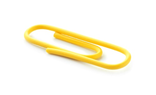 Preview: One bright paper clip isolated on white