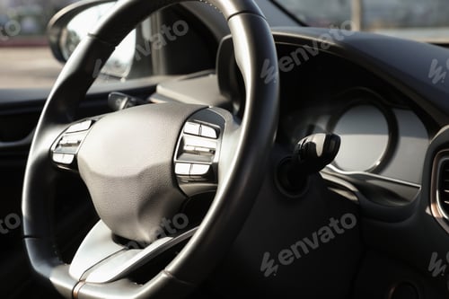 Preview: Black steering wheel inside of modern car, closeup