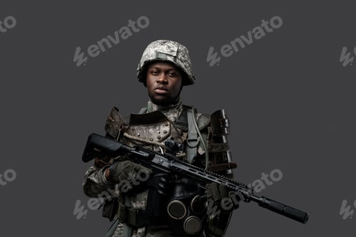 Preview: African army soldier with rifle posing against dark background