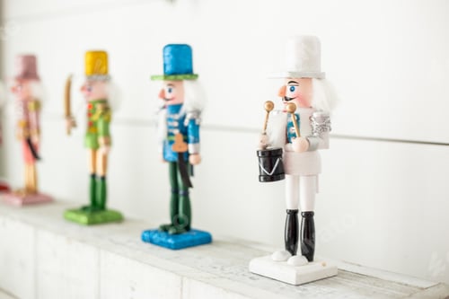 Preview: Pink red green gold blue white sparkly Christmas nutcrackers on white background