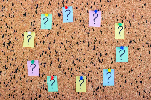 Preview: uncertainty or doubt concept, question mark on a sticky note on cork bulletin board