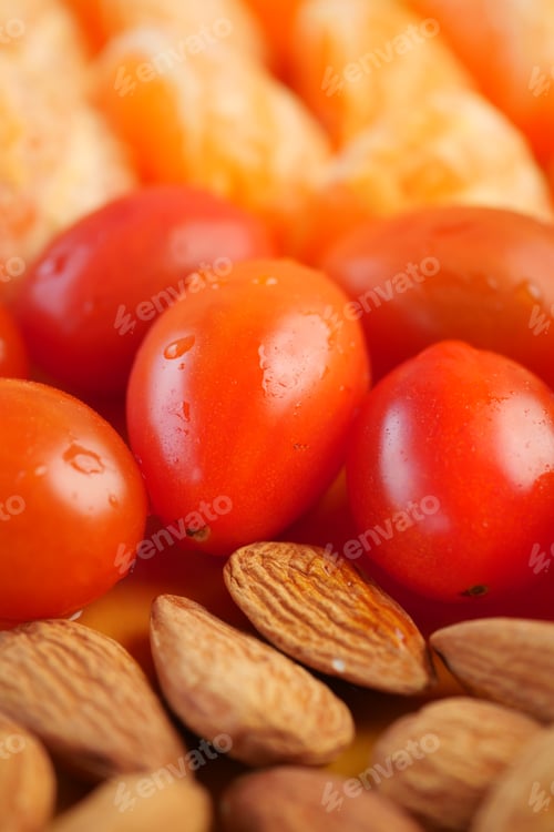 Preview: Fresh tomatoes and almonds arranged on a colorful background