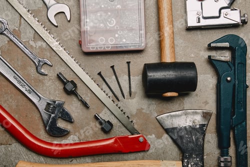 Preview: Flat lay with set of tools and smartphone on wooden background
