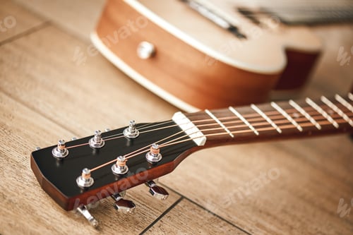 Preview: Tuning sound. Close view of guitar neck with tuning keys for adjusting guitar strings lying on the