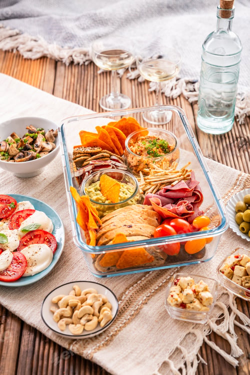 Preview: Tray with appetizers and wine for a picnic, outdoor eating