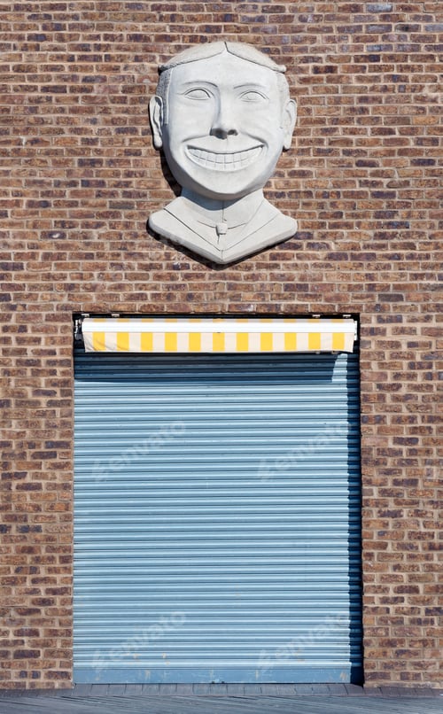 Preview: Closed Door of Self Storage Unit on beautiful brick wall