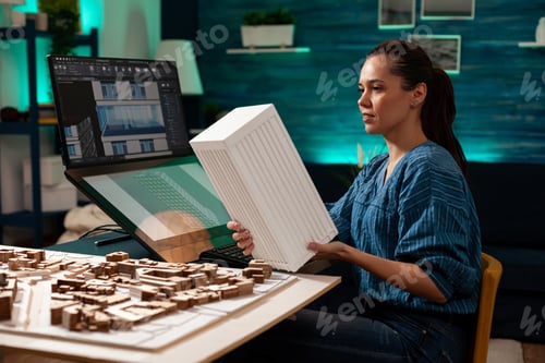 Preview: Construction architect holding modern maquette