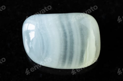 Preview: polished colorless calcite mineral on black