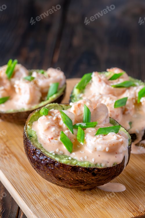 Preview: Avocado halves filled with guacamole and shrimp topped with spicy sriracha mayo