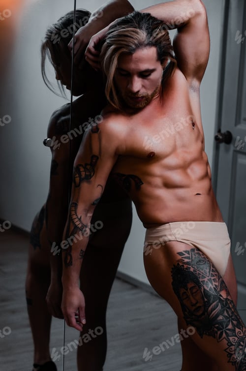 Preview: White Latin model of Venezuelan man posing for portrait, shirtless fitness body in front of mirror