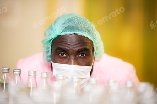 Preview: African American male engineer business worker are working to check a product in industrial factory