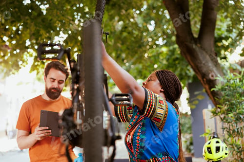 Preview: Couple researching for bike maintenance