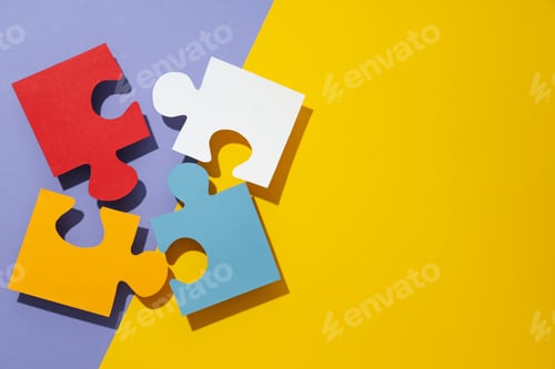 Preview: Colored paper puzzles on yellow and purple background, space for text