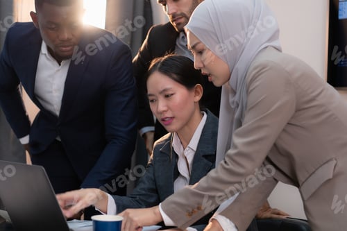 Preview: Multiethnic group of business people working together in a modern office