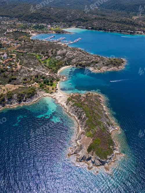 Preview: Aerial view of an island on Sithonia Peninsula, Greece, with beaches and rocks, surrounded by