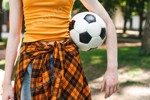 Preview: Close up of girl posing with soccer ball at the park
