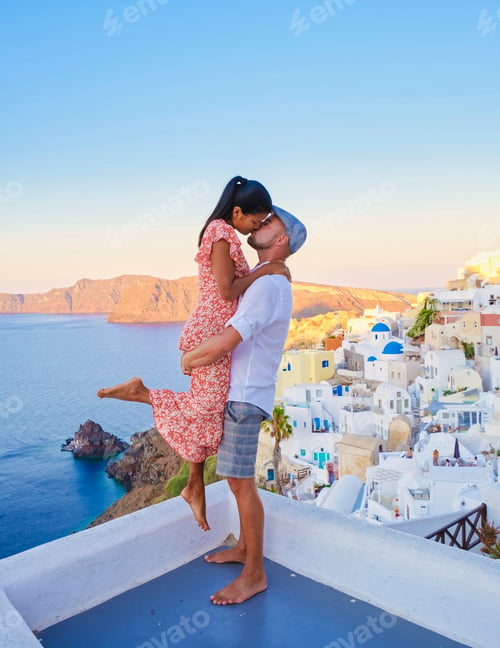 Preview: Couple hugging and kissing on a romantic vacation in Santorini Greece, men and women visit Santorini