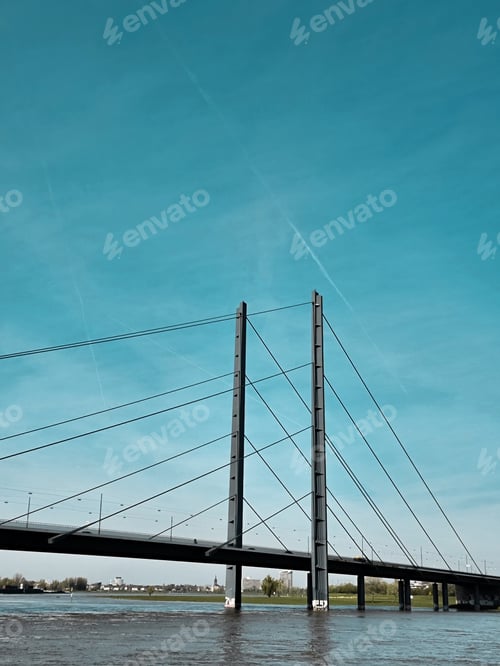 Preview: Vertical shot of a bridge over the river in England on a sunny day