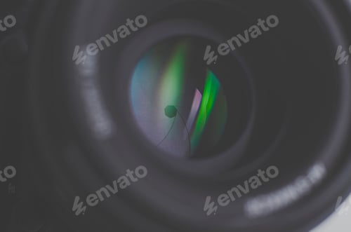 Preview: Camera lens close-up on white background