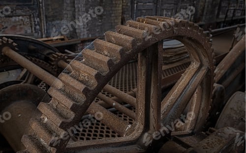 Preview: Close-up of an old rusty gear in an abandoned industrial setting