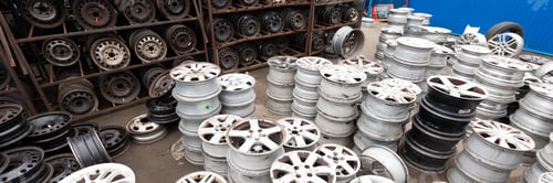 Preview: Auto parts market. Car wheels are on the ground.
