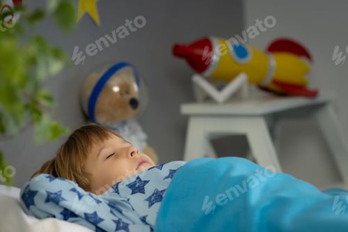 Preview: Happy child sleeping at home