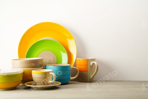 Preview: Set of colored ceramic dishware front view