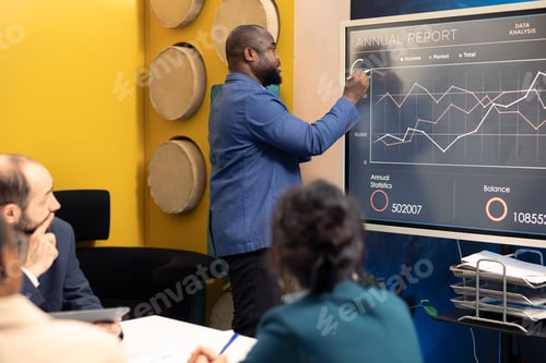 Preview: Marketing and PR group meeting to review infographics in conference room