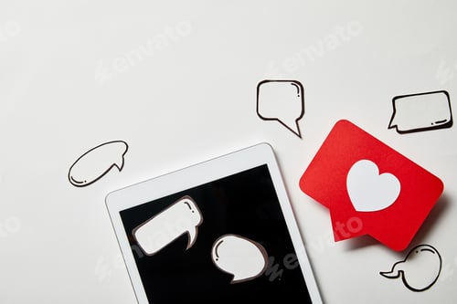 Preview: digital tablet with paper like sign, thought and speech bubbles on white surface