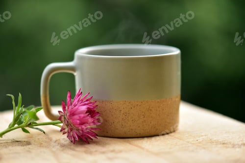 Preview: Ceramic cup for the first morning coffee with a delicate flower on a wooden table